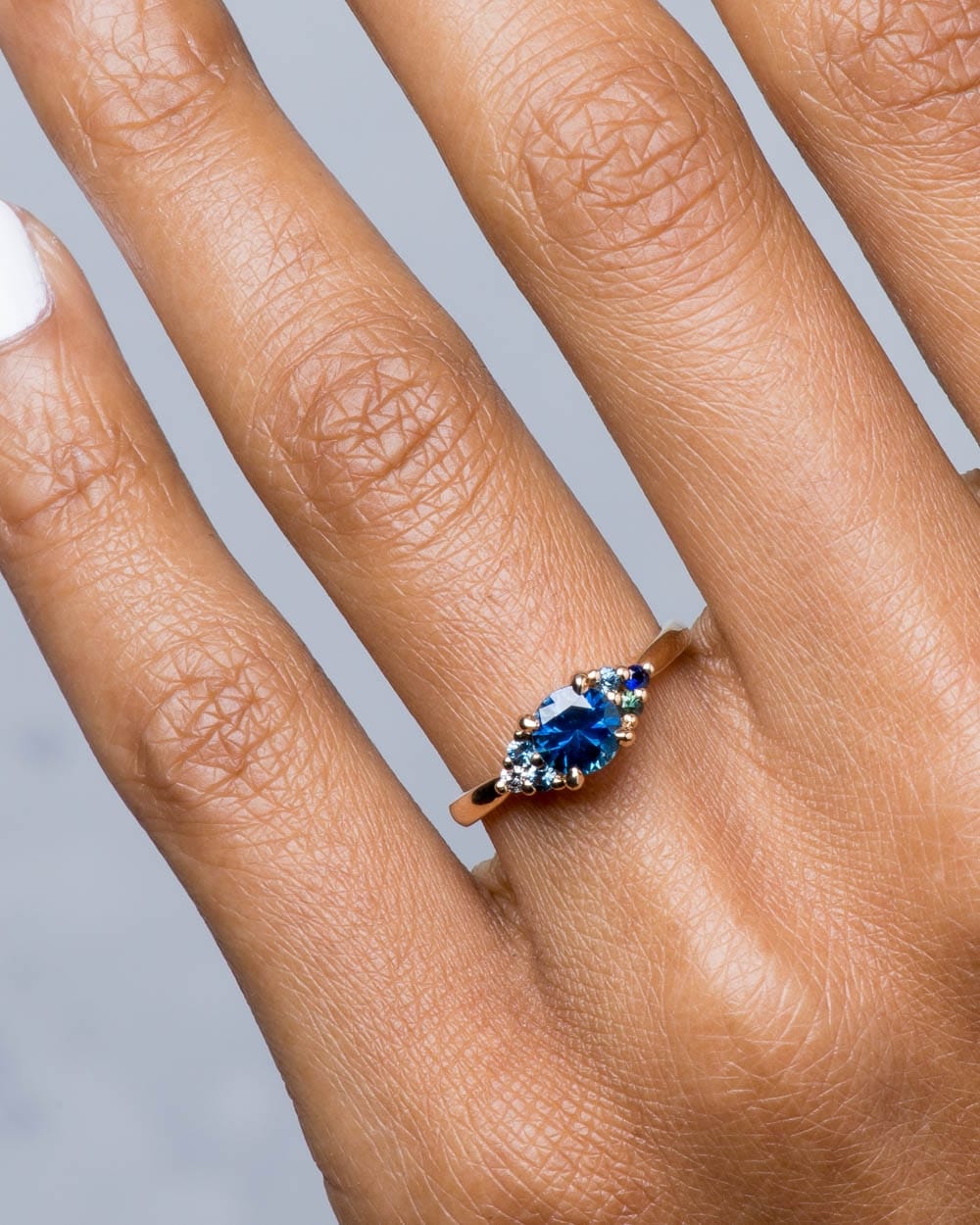 2019_on_figure_18d_avens_symmetrical_blue_sapphire_ombre_ring_14y_1_web2.jpg