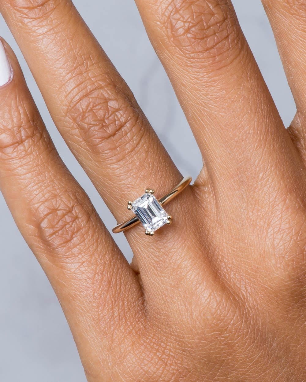 Ray Diamond Emerald Cut Ring on figure