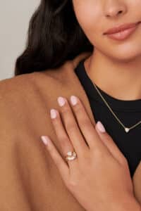 Trillion White Sapphire Ring with Trillion Curved Diamond Band on figure