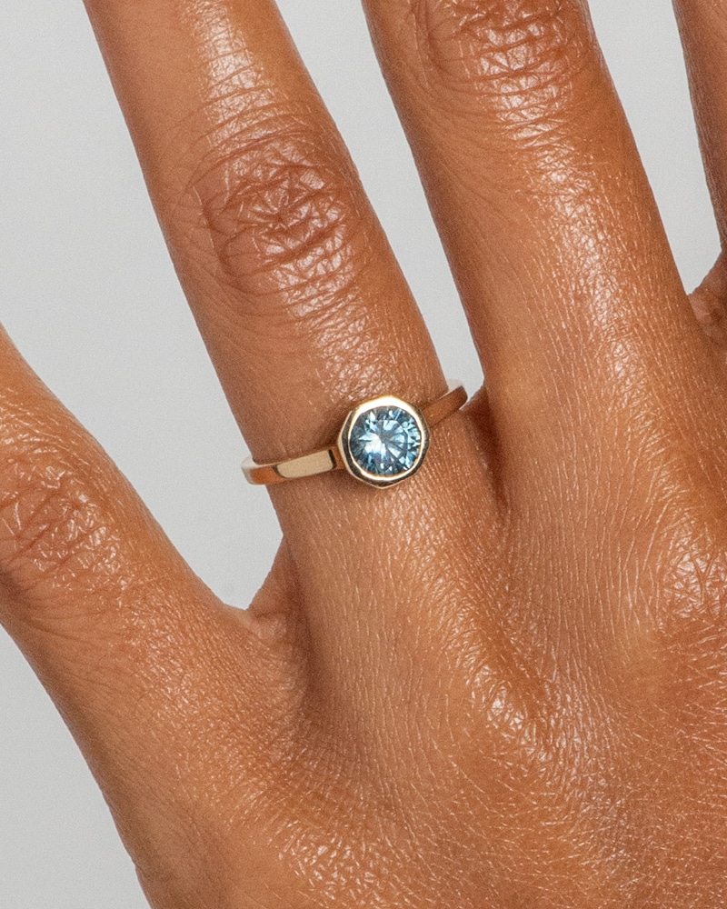 Allium Octad Blue Green Sapphire Ring on figure