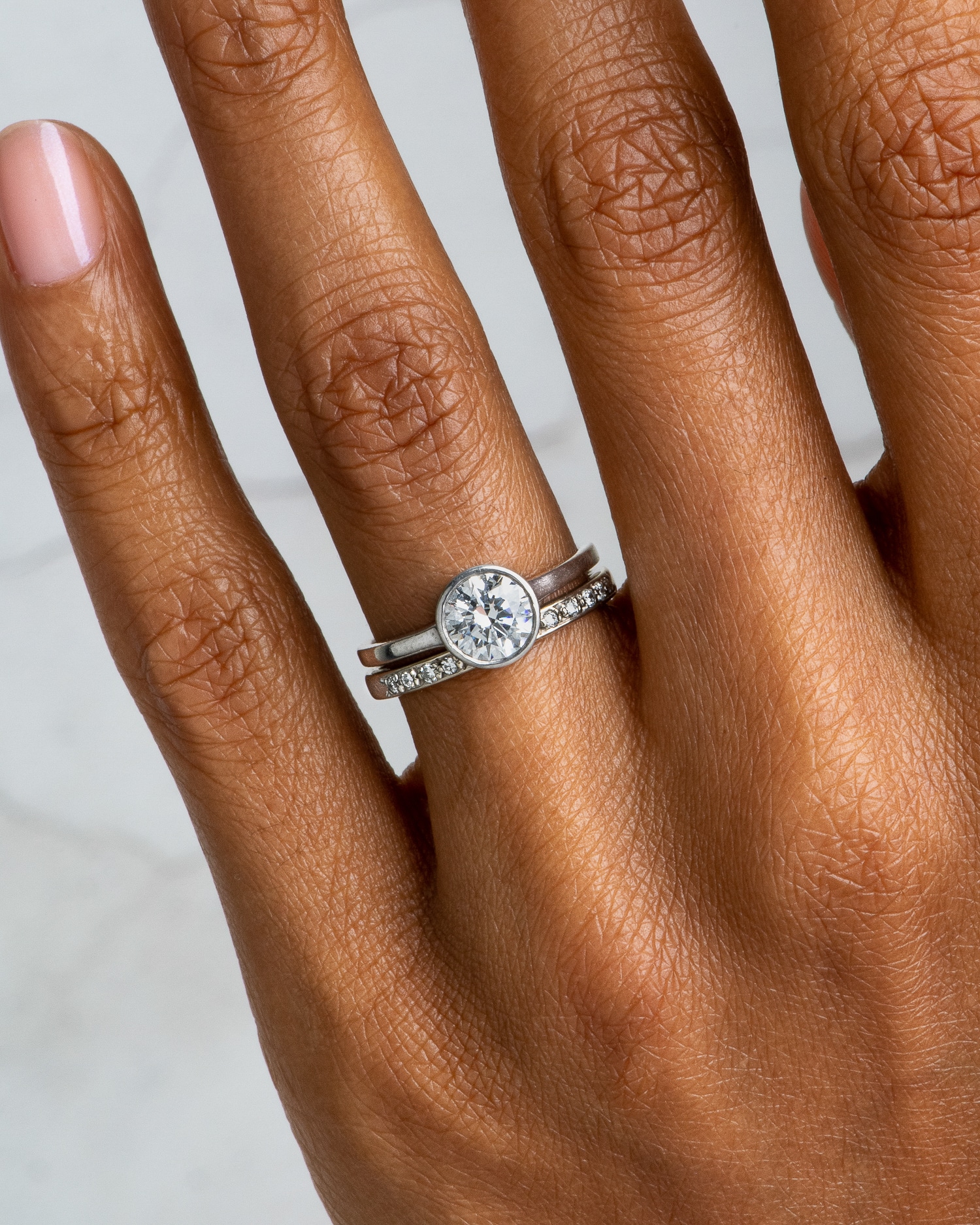 Allium Diamond Ring and Luma Diamond Band on figure