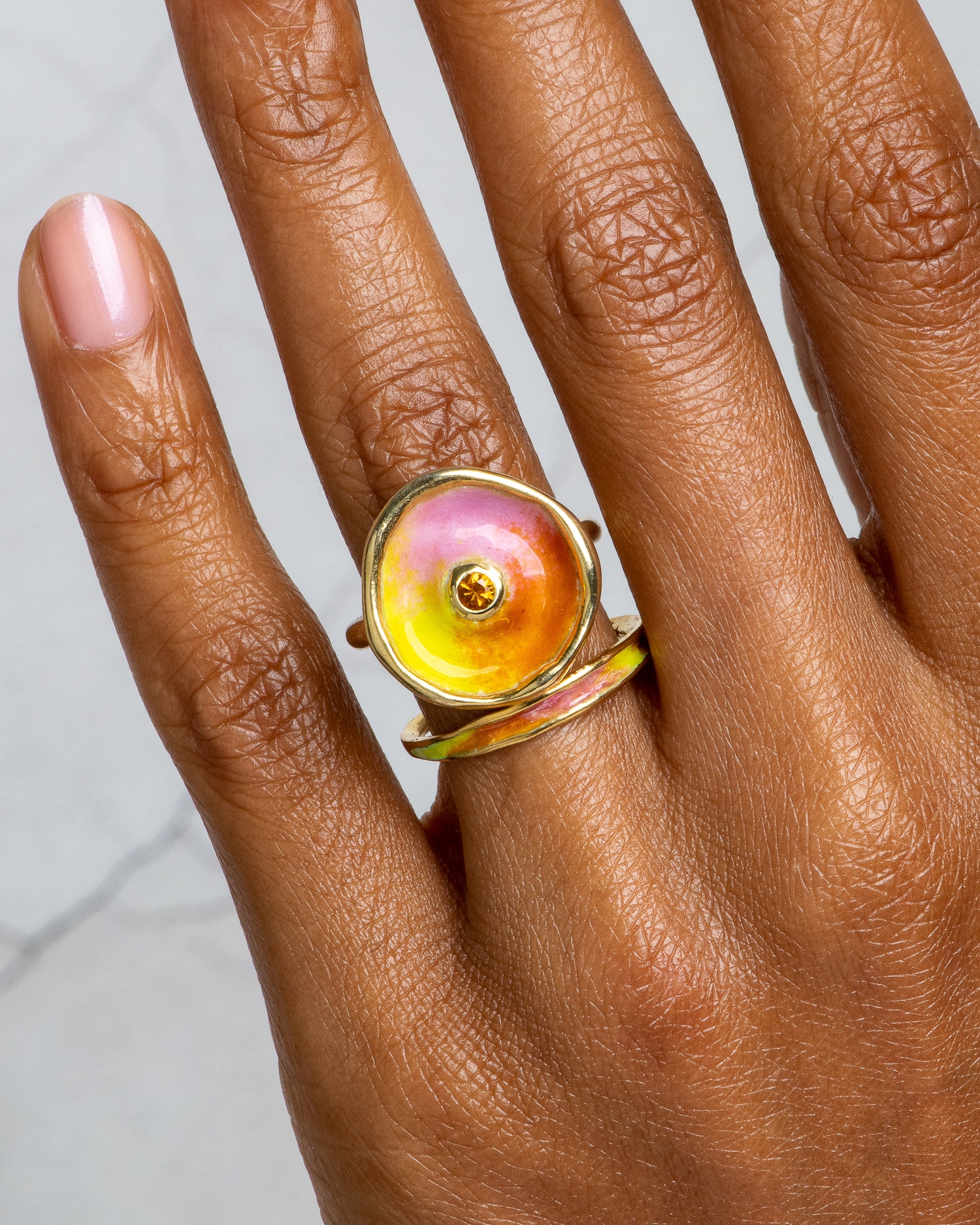 Arc Band with Sun Crush Enamel and Arc Apricot Sapphire Halo Ring with Sun Crush Enamel on figure