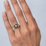 Bario Neal Senna Diamond Halo Engagement Ring with Black Enamel and Senna Narrow Wedding Band with White Enamel on a hand.