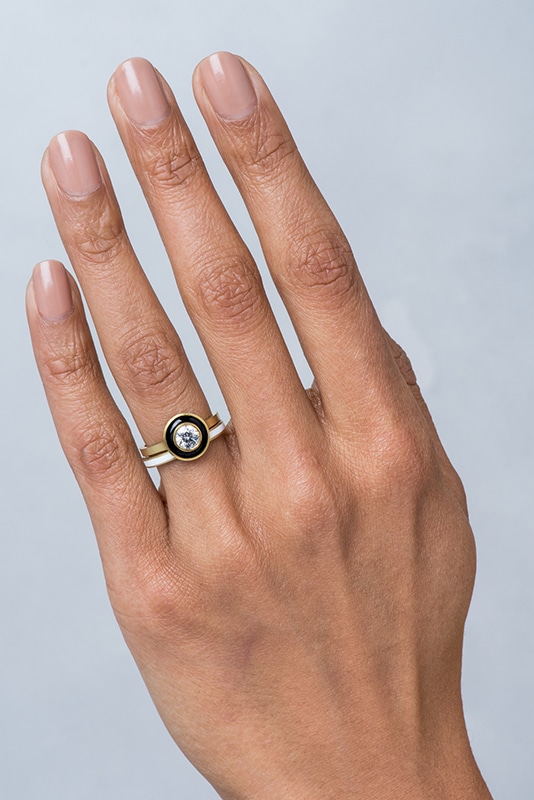 Bario Neal Senna Diamond Halo Engagement Ring with Black Enamel and Senna Narrow Wedding Band with White Enamel on a hand.