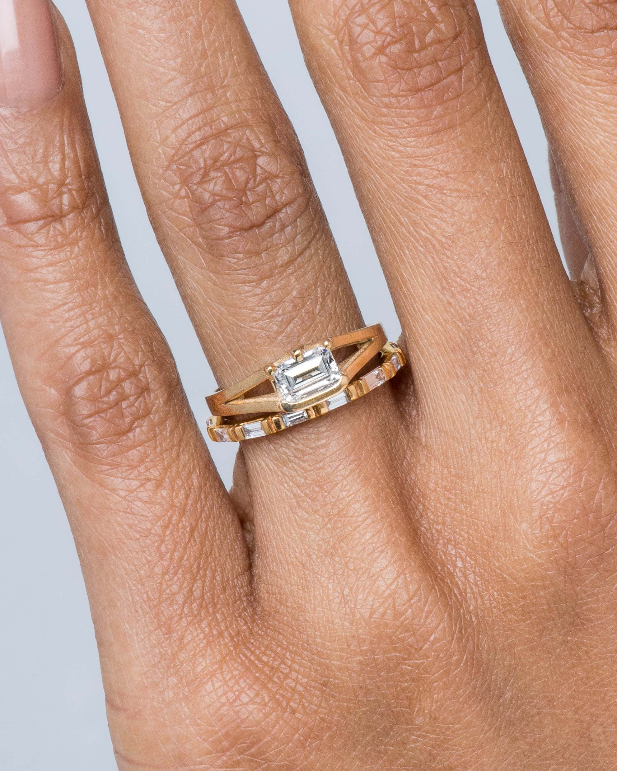 Baguette Diamond Band and Myrtle Diamond Emerald Cut Ring on figure