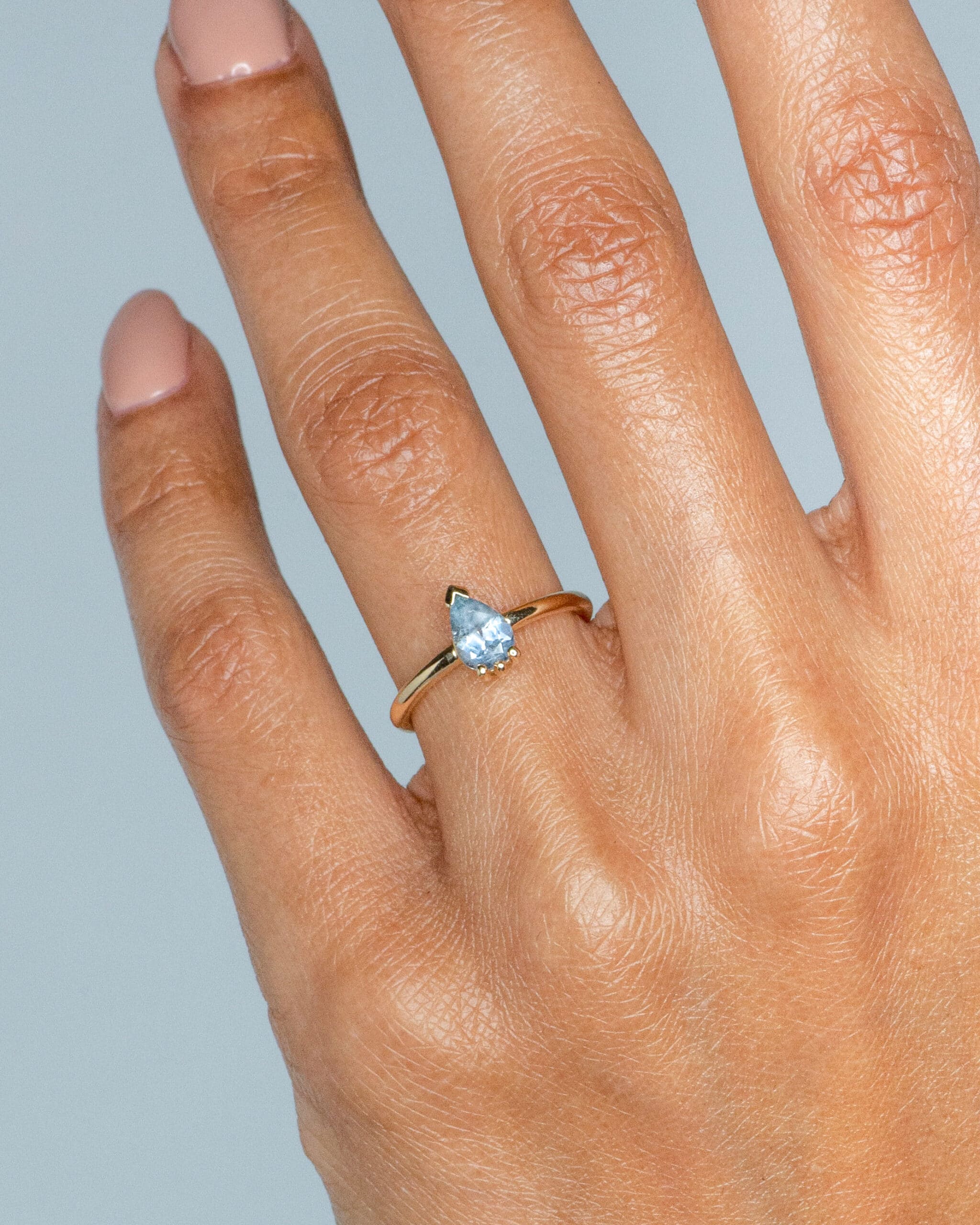 Lash Sky Blue Sapphire Pear Ring on figure