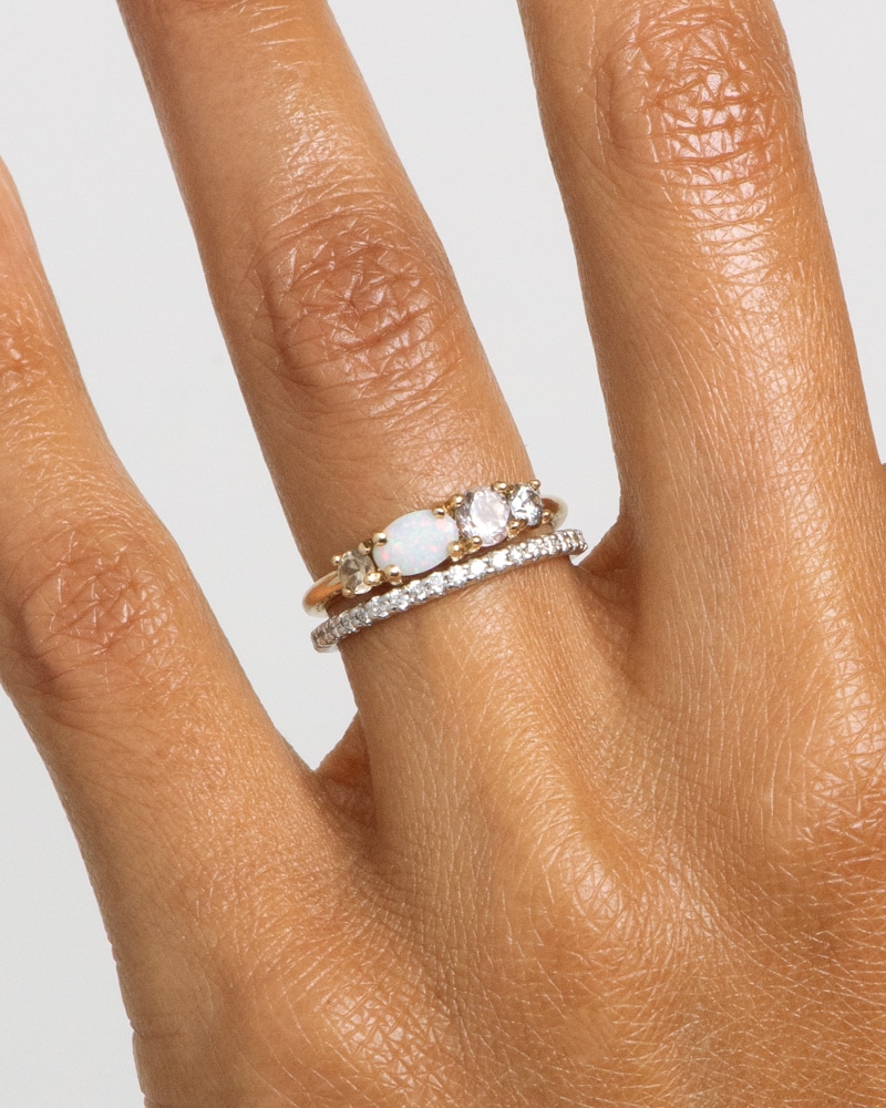 Linear Opal Ring and Eternity Diamond Band on figure