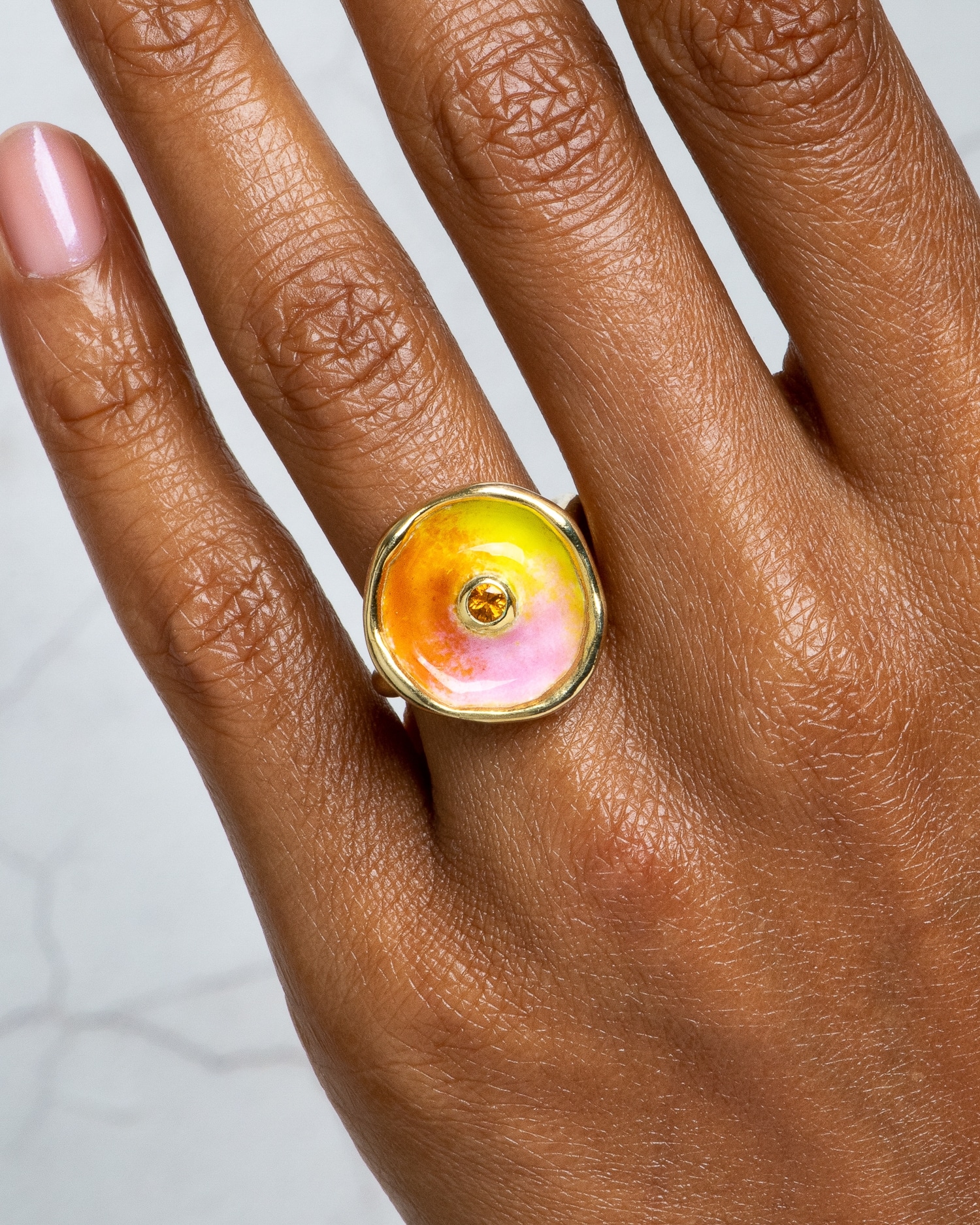 Arc Apricot Sapphire Halo Ring with Sun Crush Enamel on figure