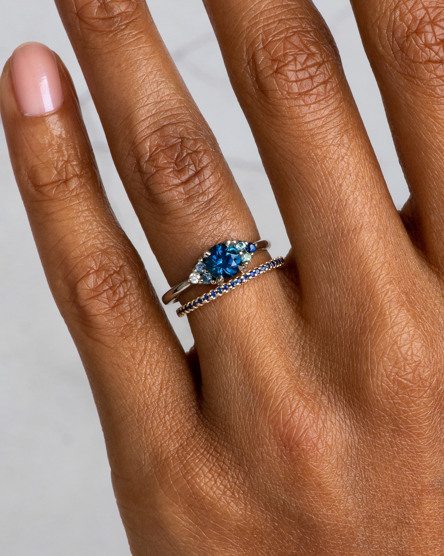 avens_symmetrical_blue_sapphire_ombre_ring_and_eternity_blue_sapphire_narrow_band_dsc4509_web2_1.jpg