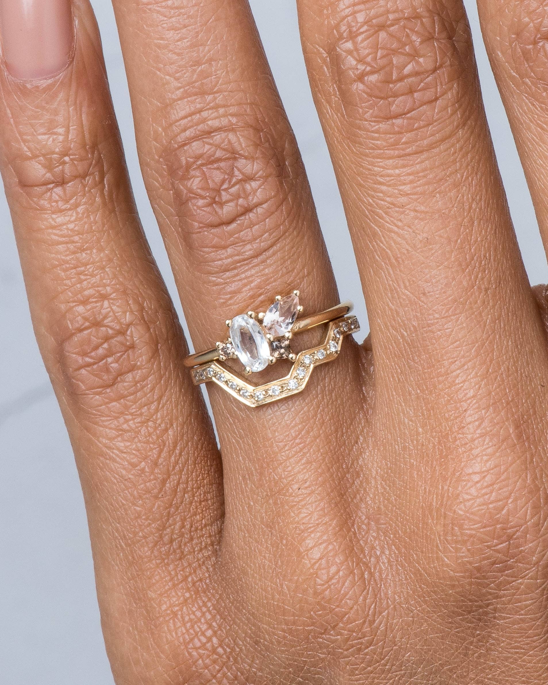 Eaves Cluster White Sapphire Oval with Morganite Ring and Linea Diamond Band on figure