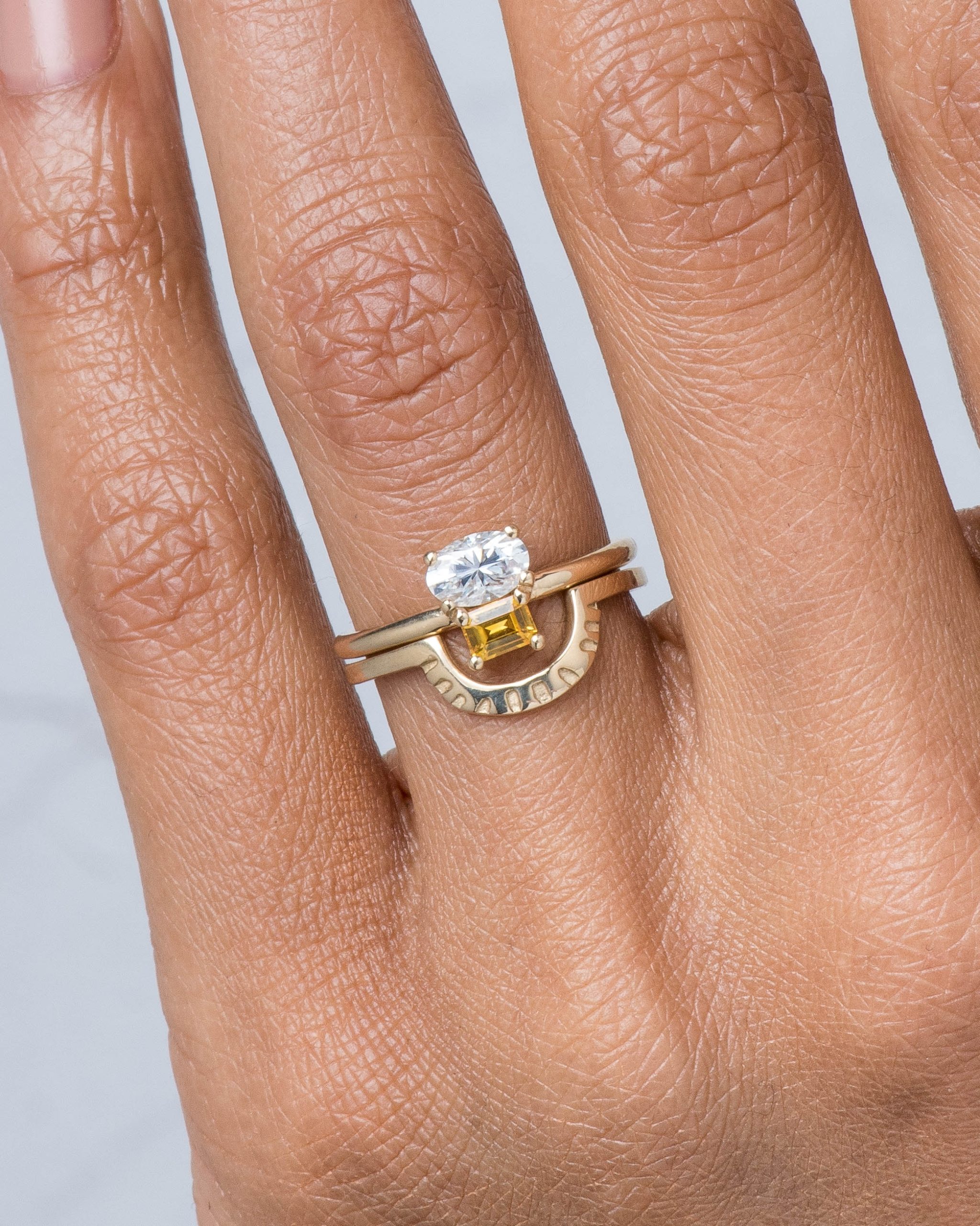 Ray Fringe Band and Orla Cluster Diamond Oval with Sapphire Ring on figure