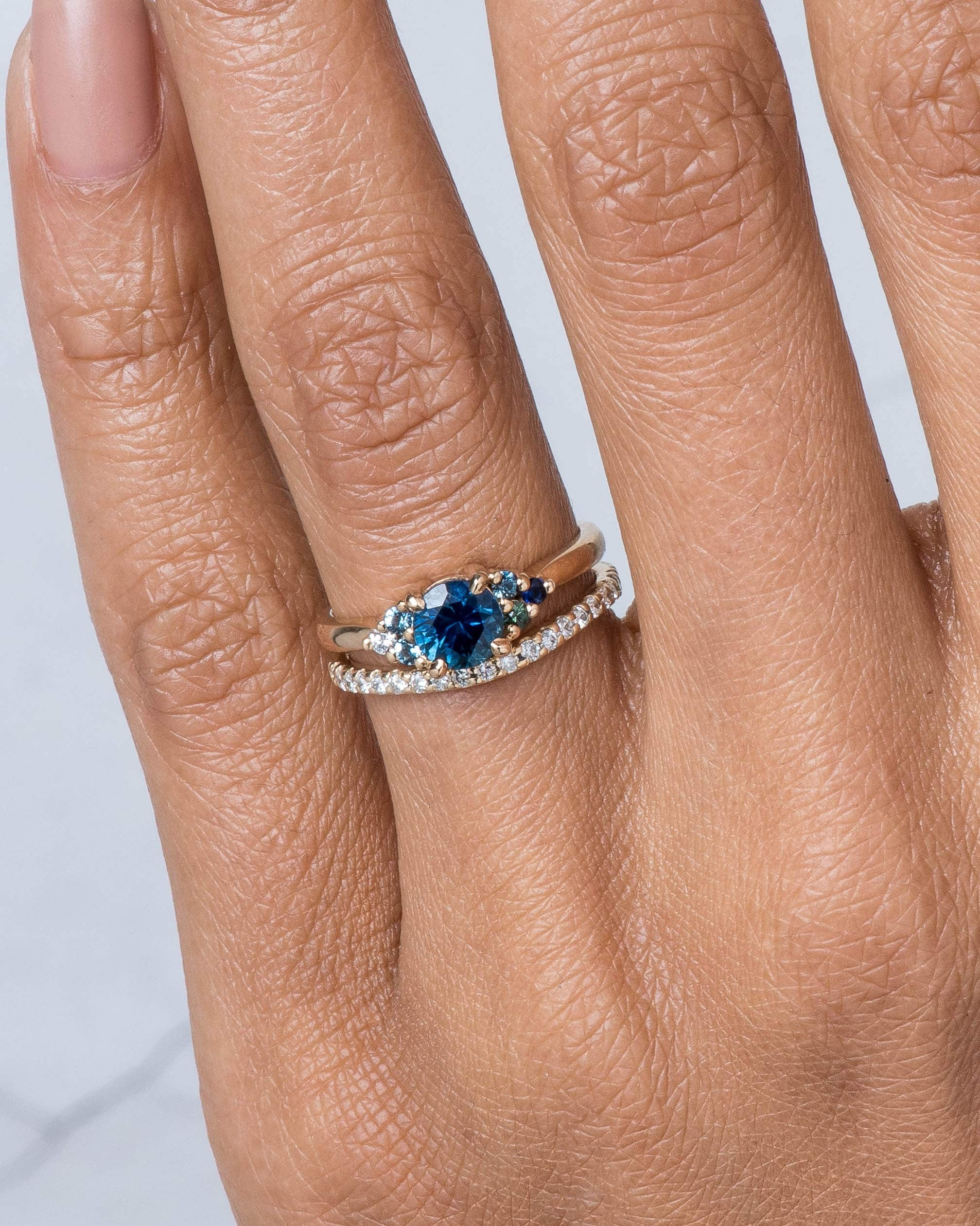 dsc1155_avens_symmetrical_blue_sapphire_ombre_ring___eternity_half_curved_diamond_band_web_2_1.jpg