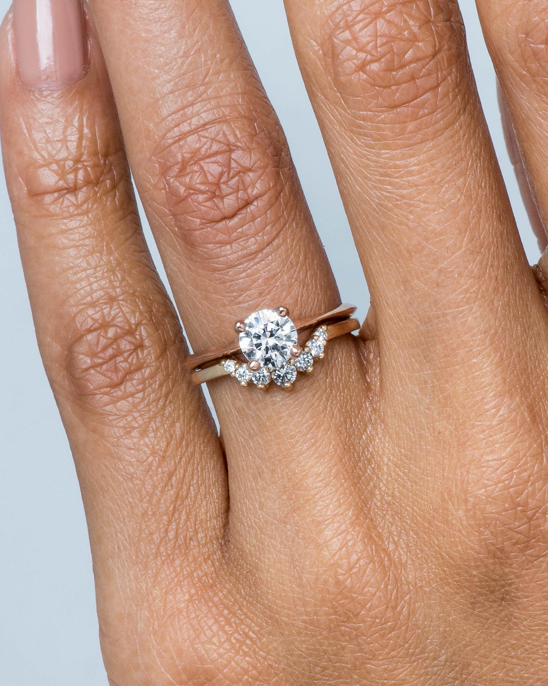 Arco Curved Diamond Band and Avens Diamond Ring on figure