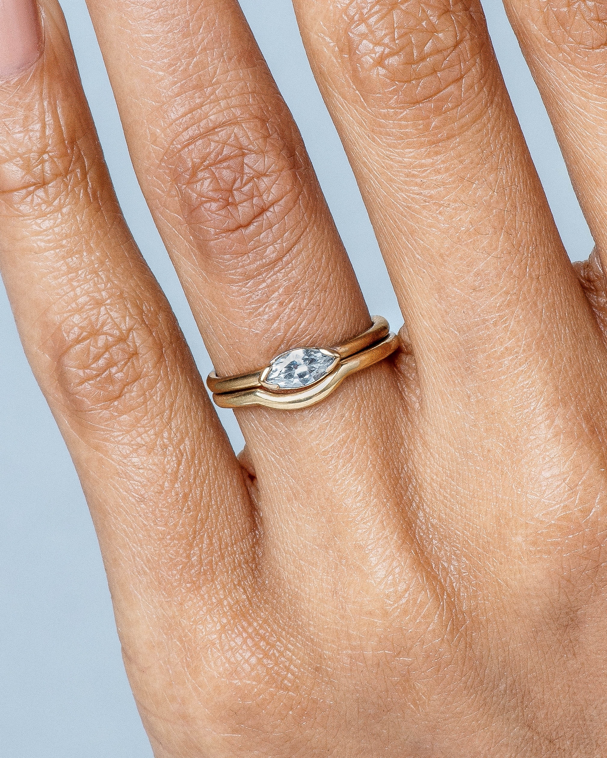 Nikko Curved Band and Nikko Diamond Marquise Ring on figure