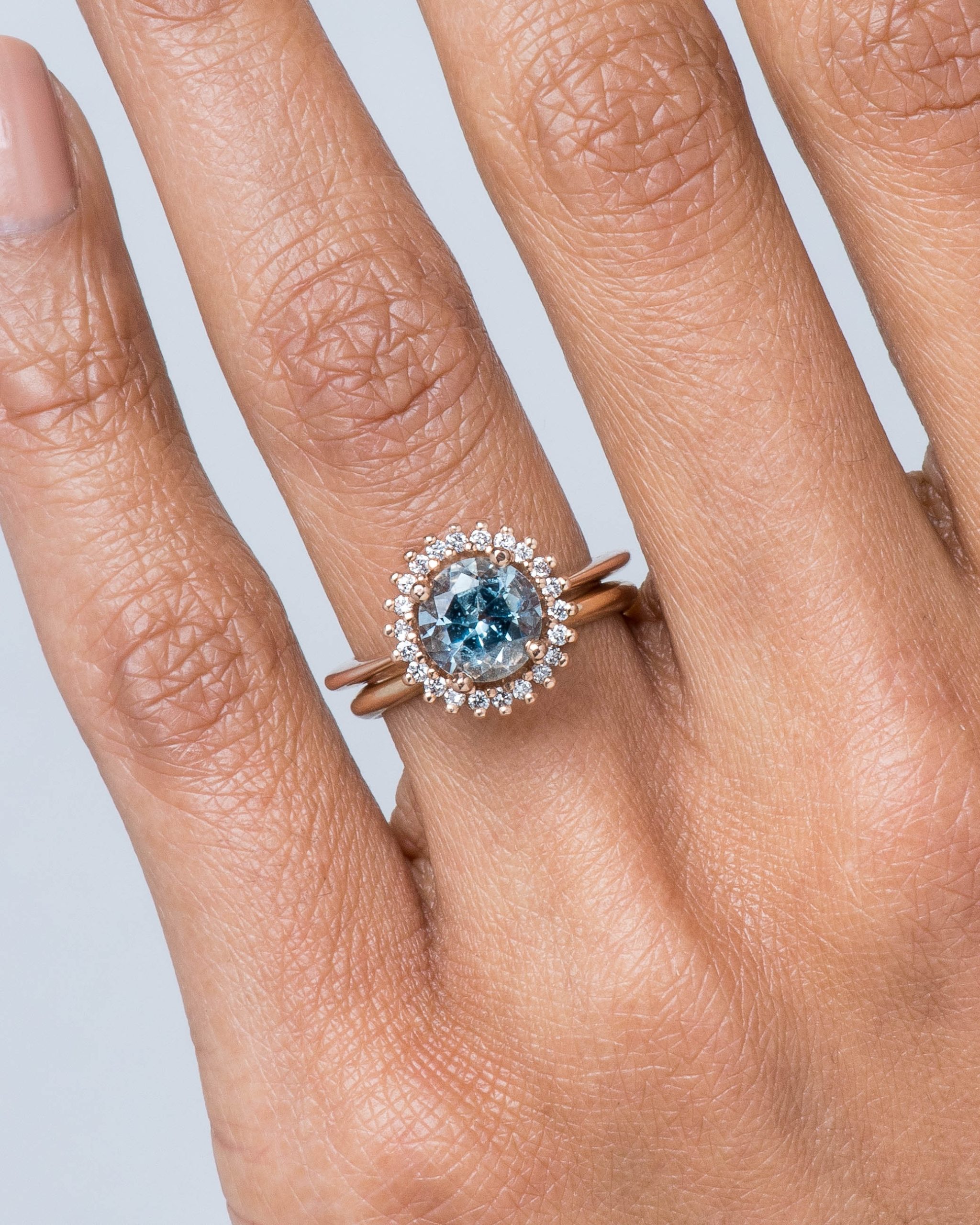 Stellium Aquamarine with Diamond Halo Ring and Stackable Band on figure