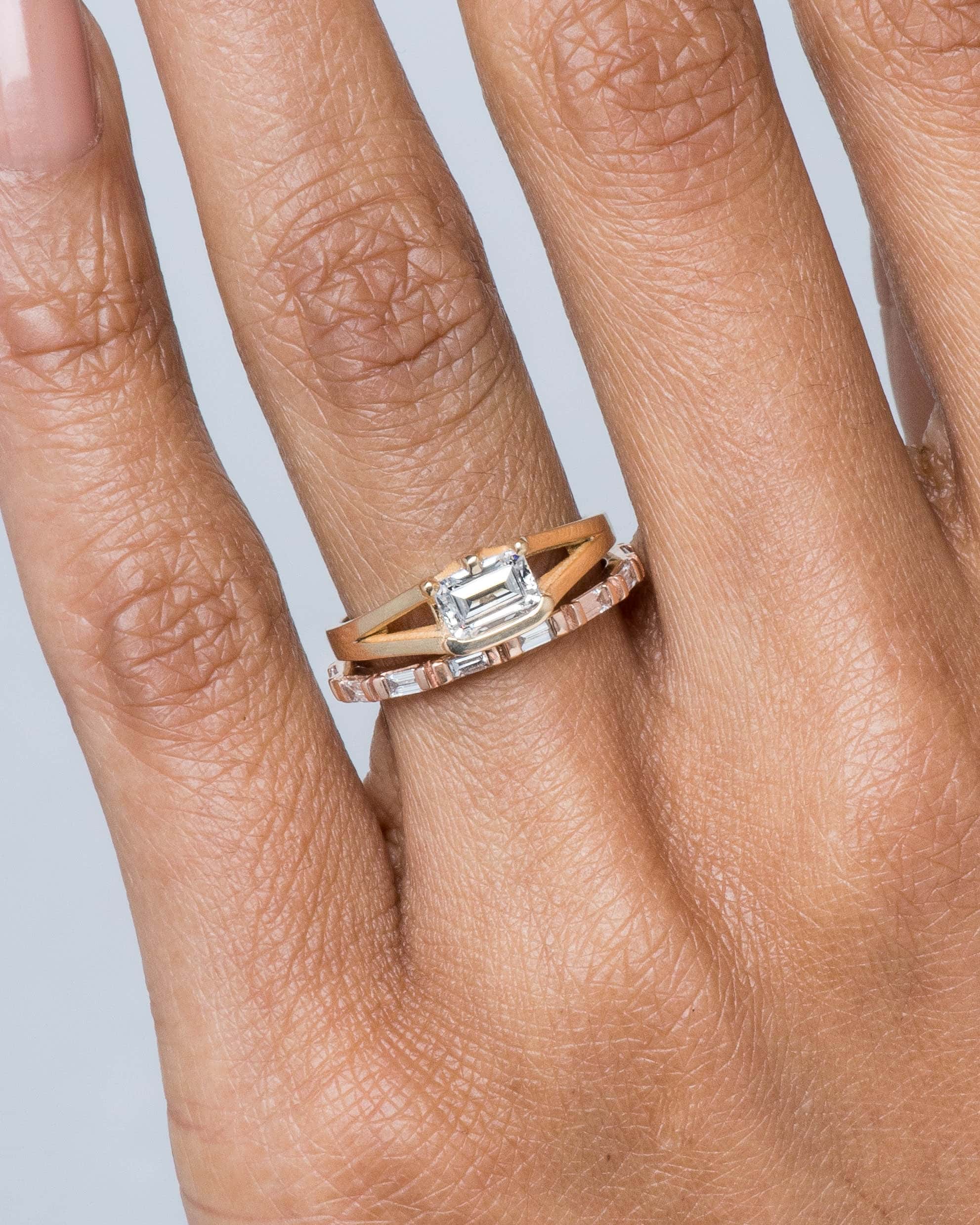 Baguette Diamond Band and Myrtle Diamond Emerald Cut Ring on figure