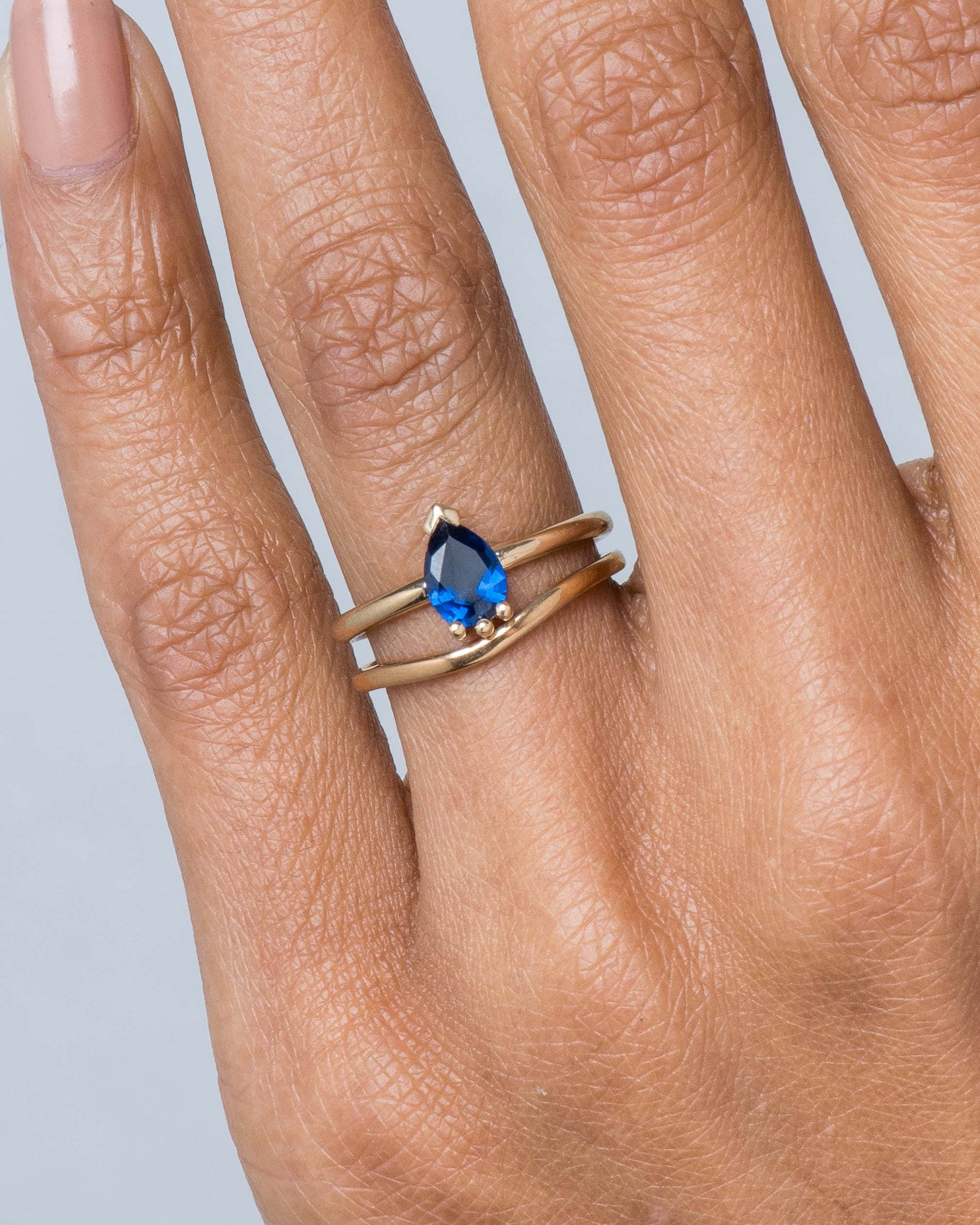 dsc2411_lash_blue_sapphire_pear_ring___milla_curved_band-add_colorway_web_2.jpg