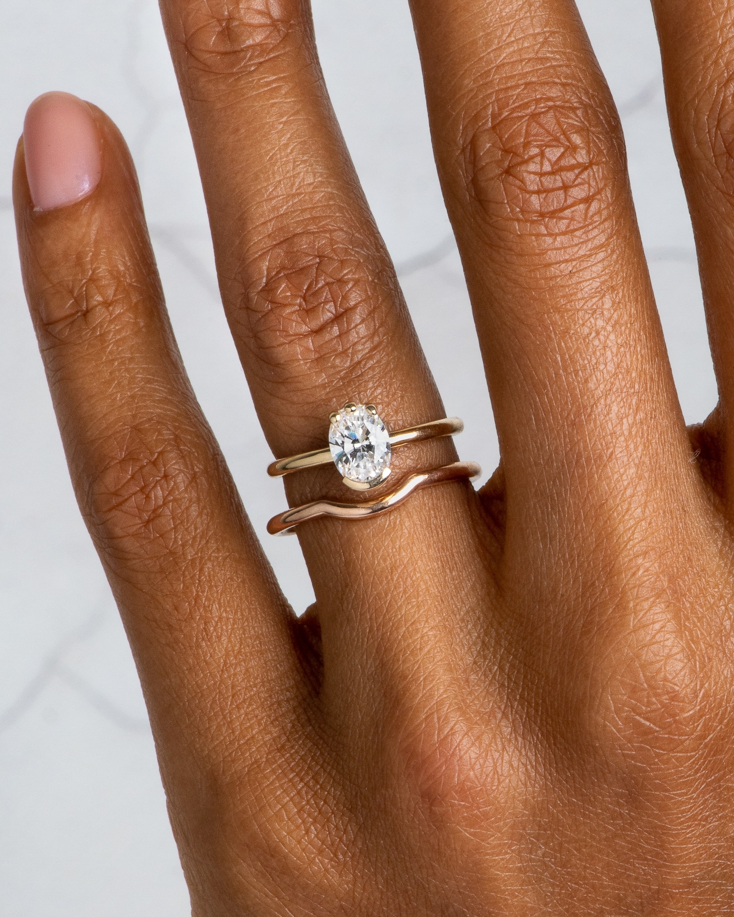 Lash Diamond Oval Ring and Nikko Curved Band on figure