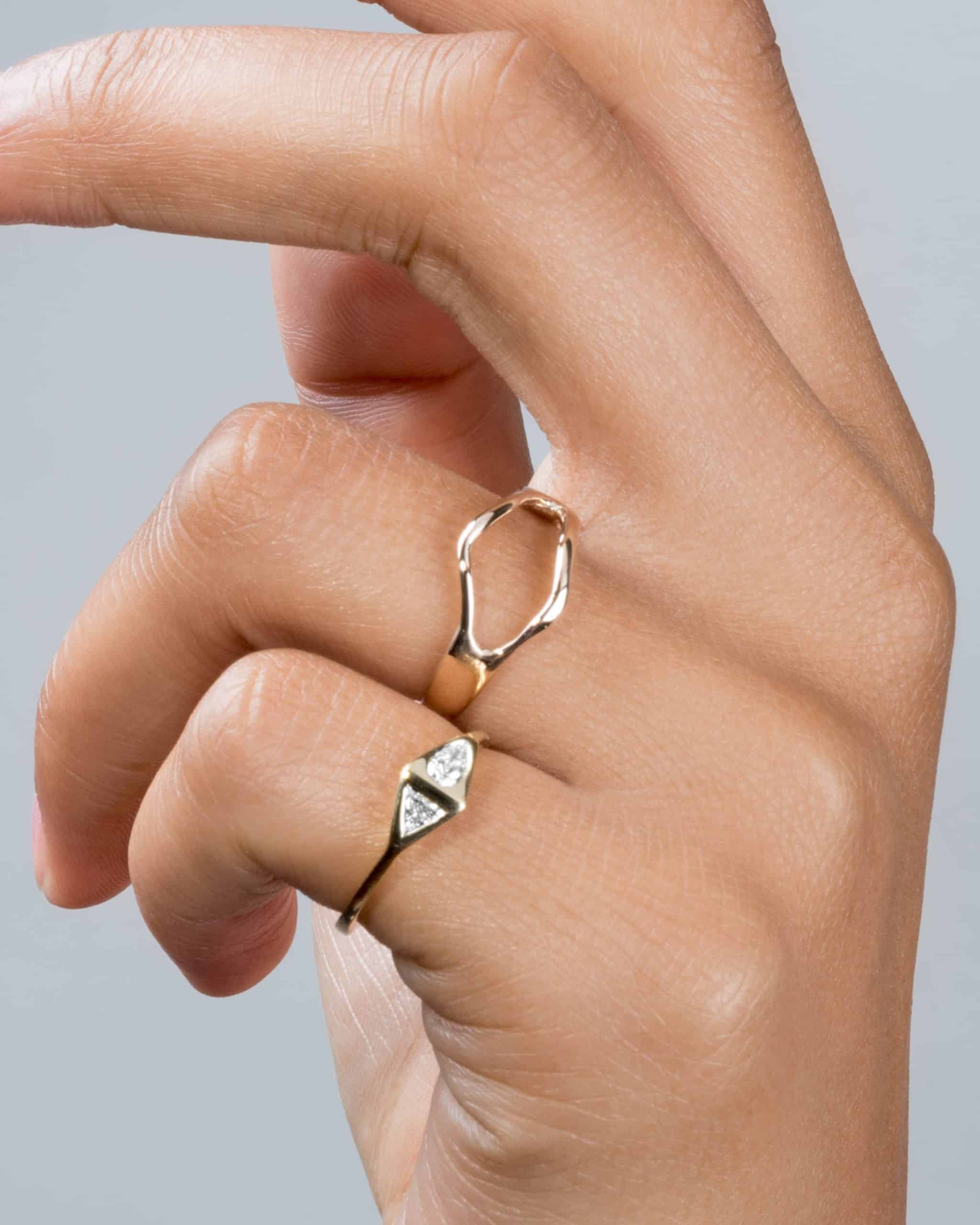 Bend Ring and Pear Trillion Ring on figure