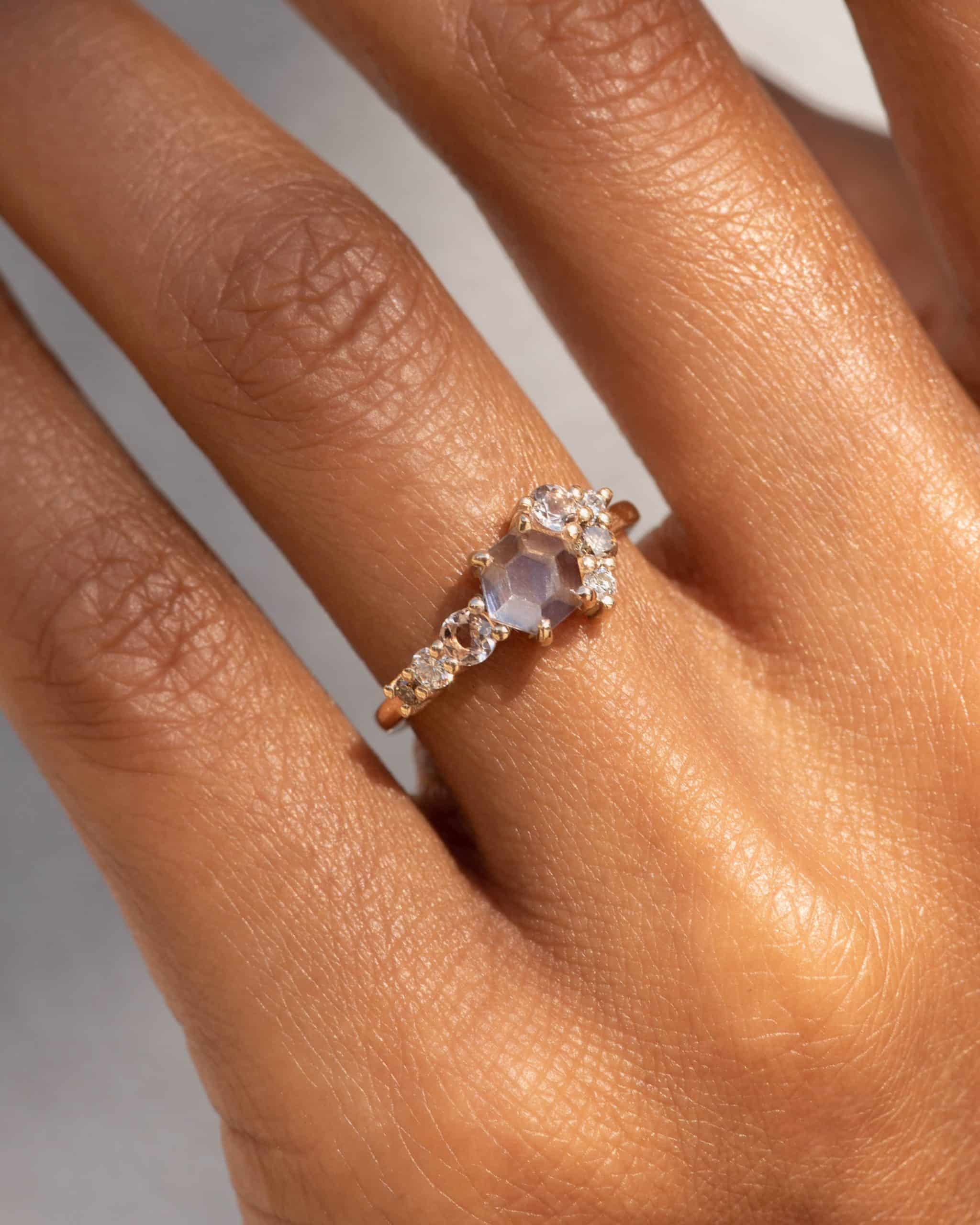 radial_cluster_white_hex_sapphire_ring_on_fig-0361-2_web_2.jpg