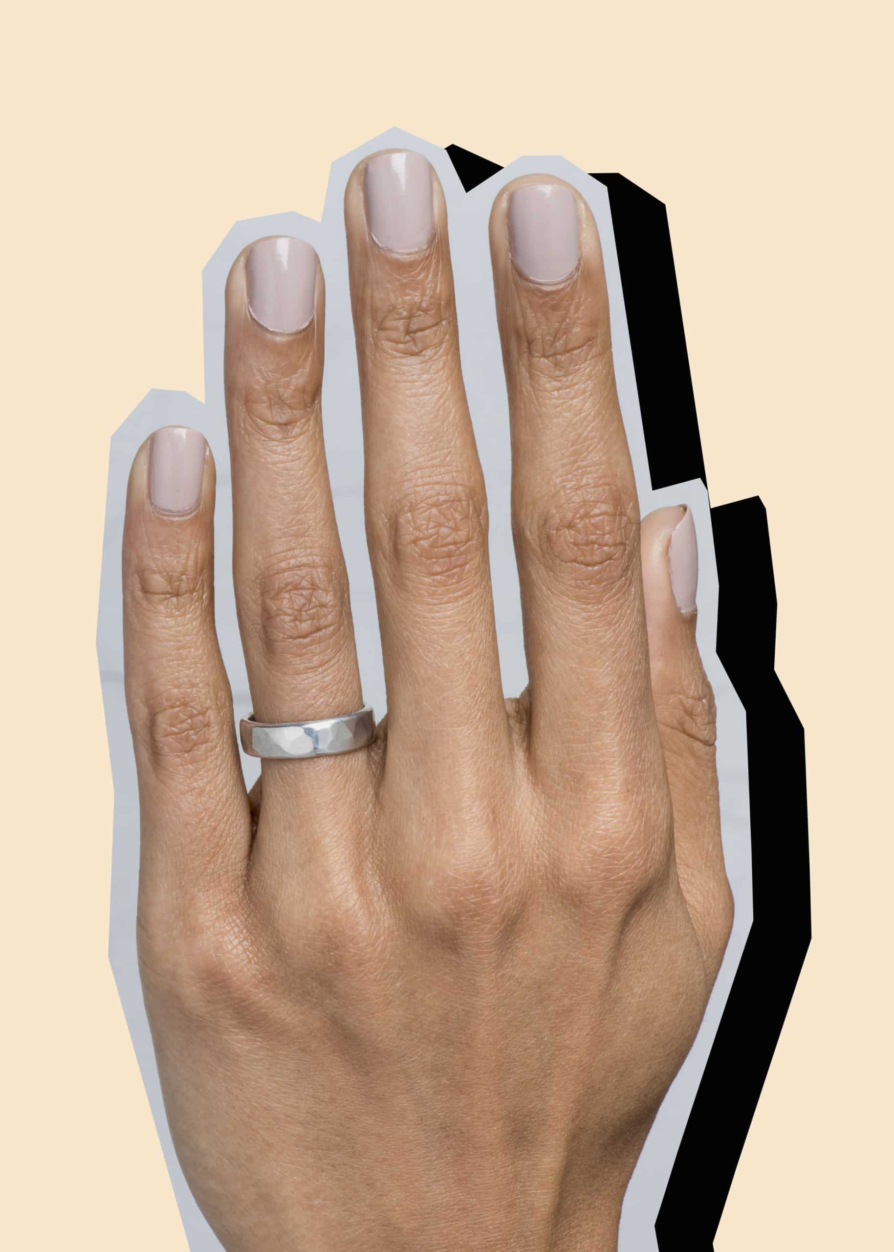 Collage image of a hand wearing a Bario Neal recycled palladium wedding band with a drop shadow.