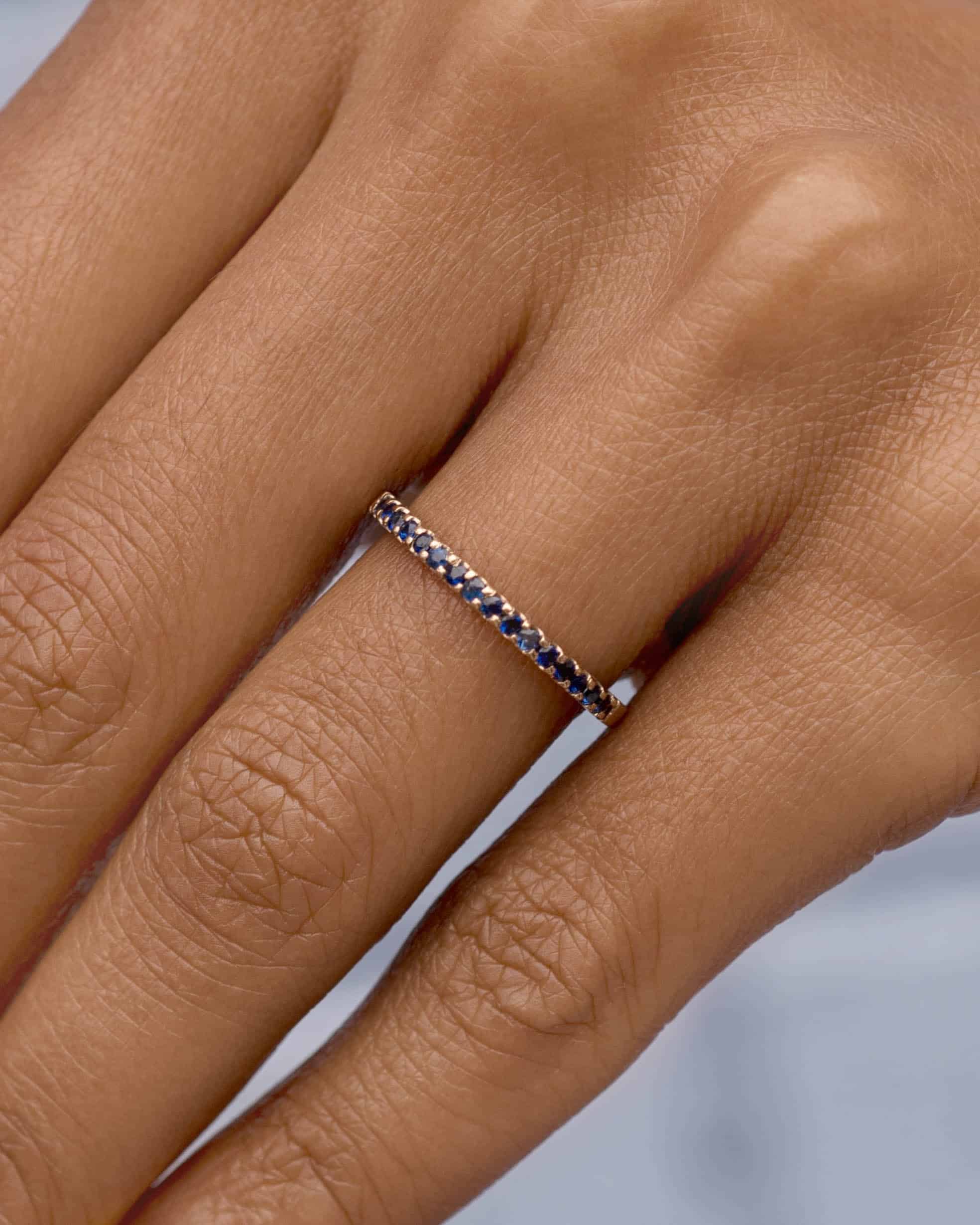 vibrant_on_fig_eternity_blue_sapphire_band_web_1-2_web_2_1_1.jpg