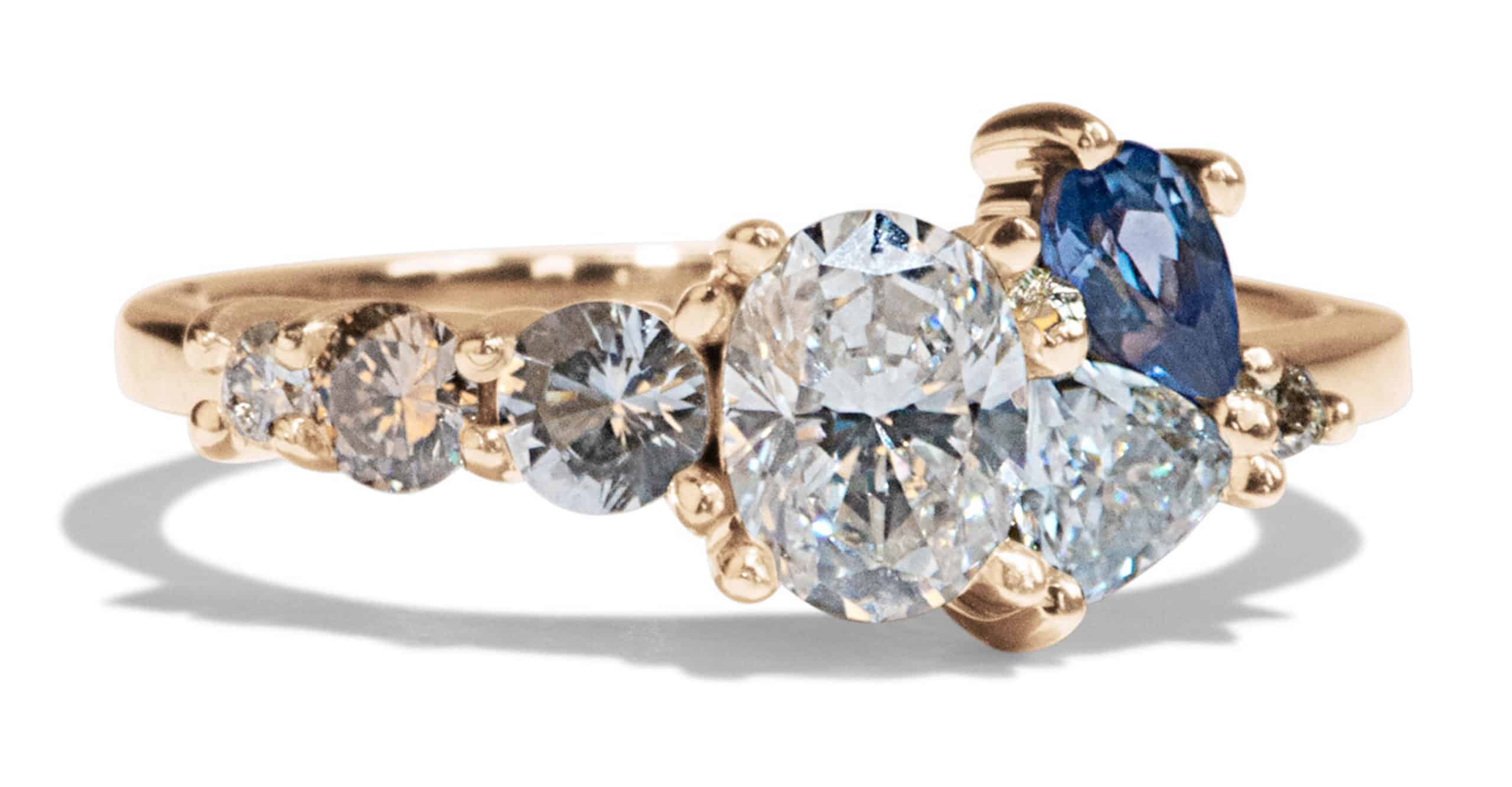 Custom Oval Cut Diamond and Blue Sapphire Cluster Ring