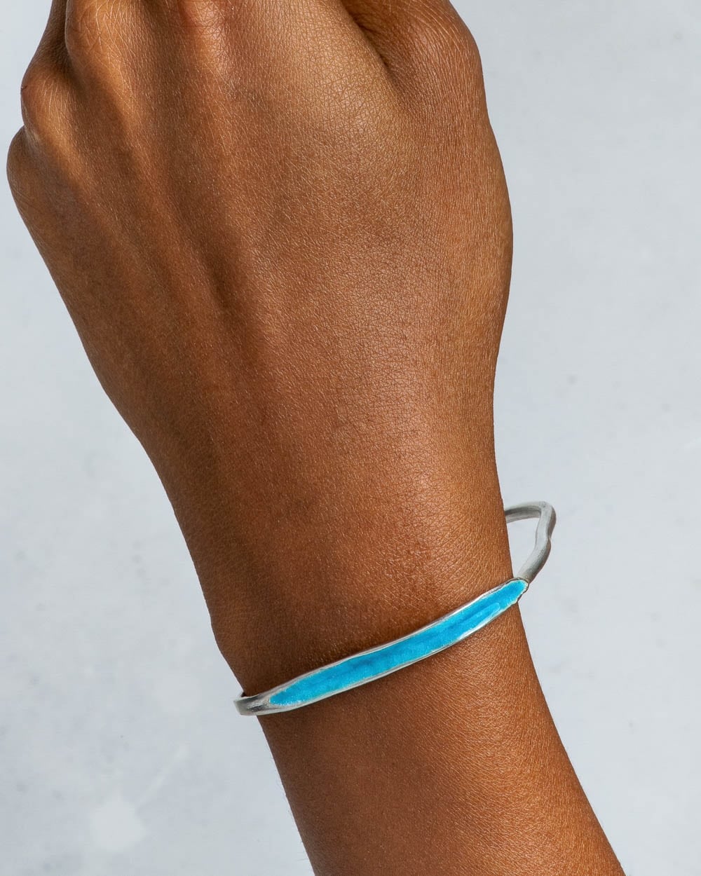 Arc Bracelet with Robin’s Egg Blue Enamel on figure