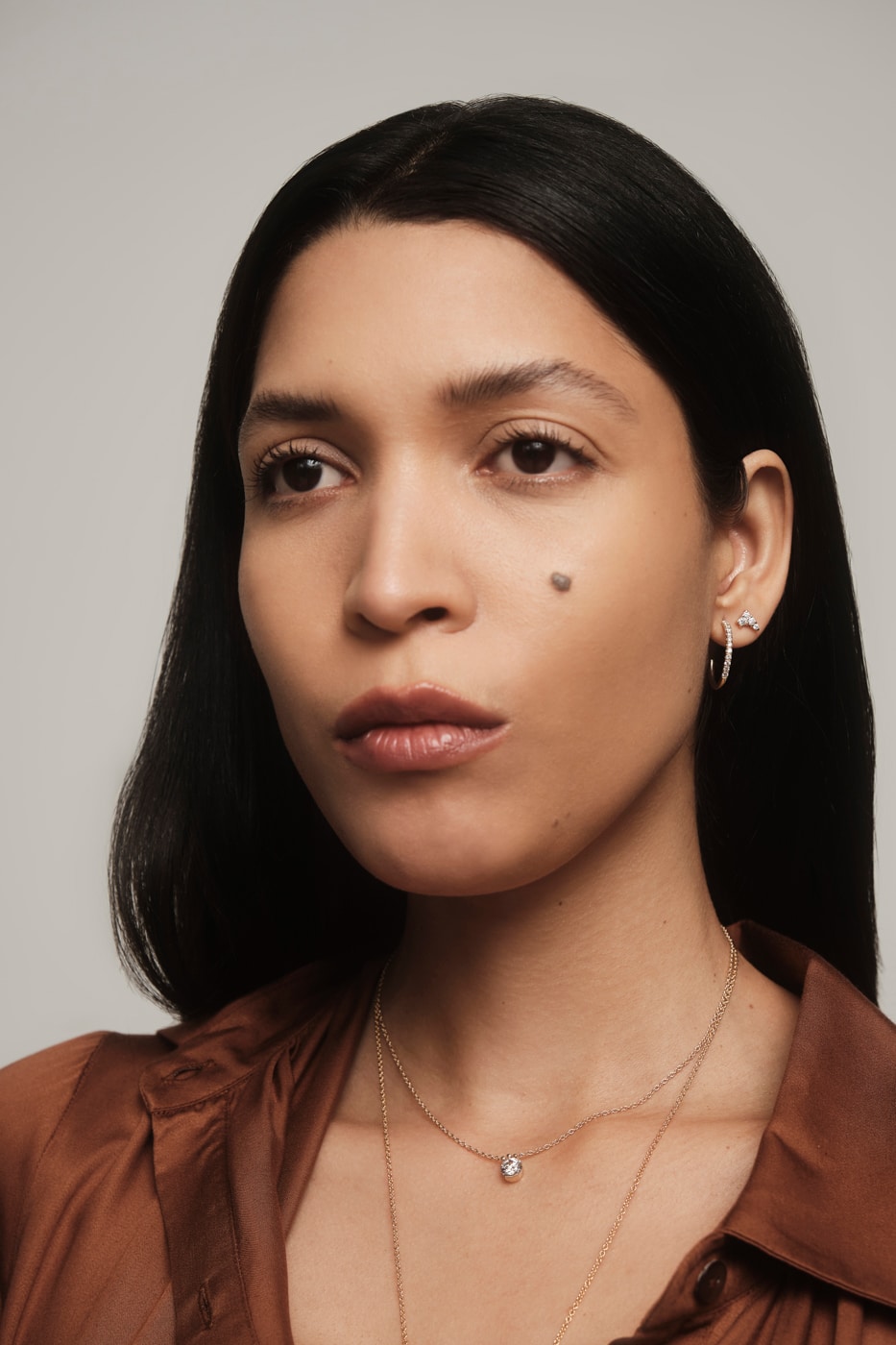 On Figure Image of woman wearing hoop earrings.