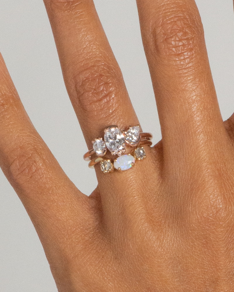 Lash Triad Eaves Diamond Ring and Icon Hex Opal Oval Ring on figure