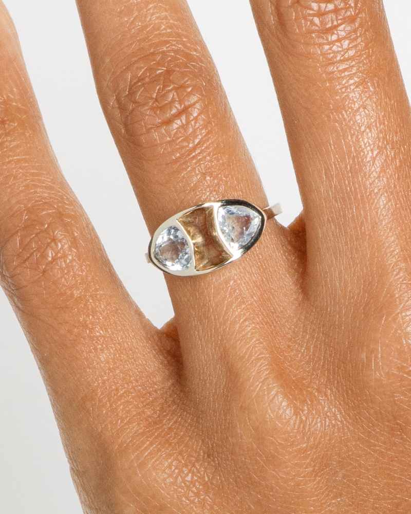 Trillion Dyad Ellipse White Sapphire Ring on figure
