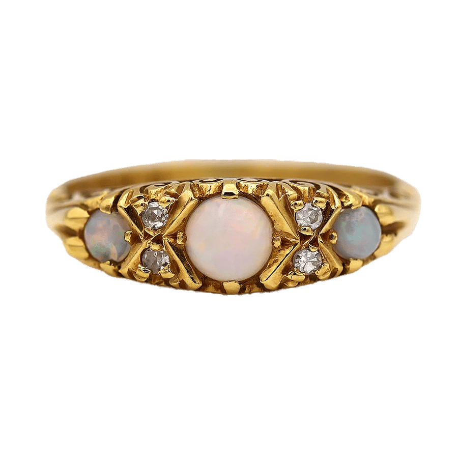 The Santa Fe ring is an authentic Victorian opal wedding ring circa 1900's. This ring features three (3) natural pastel cabochon opals and four (4) single cut diamond accents.