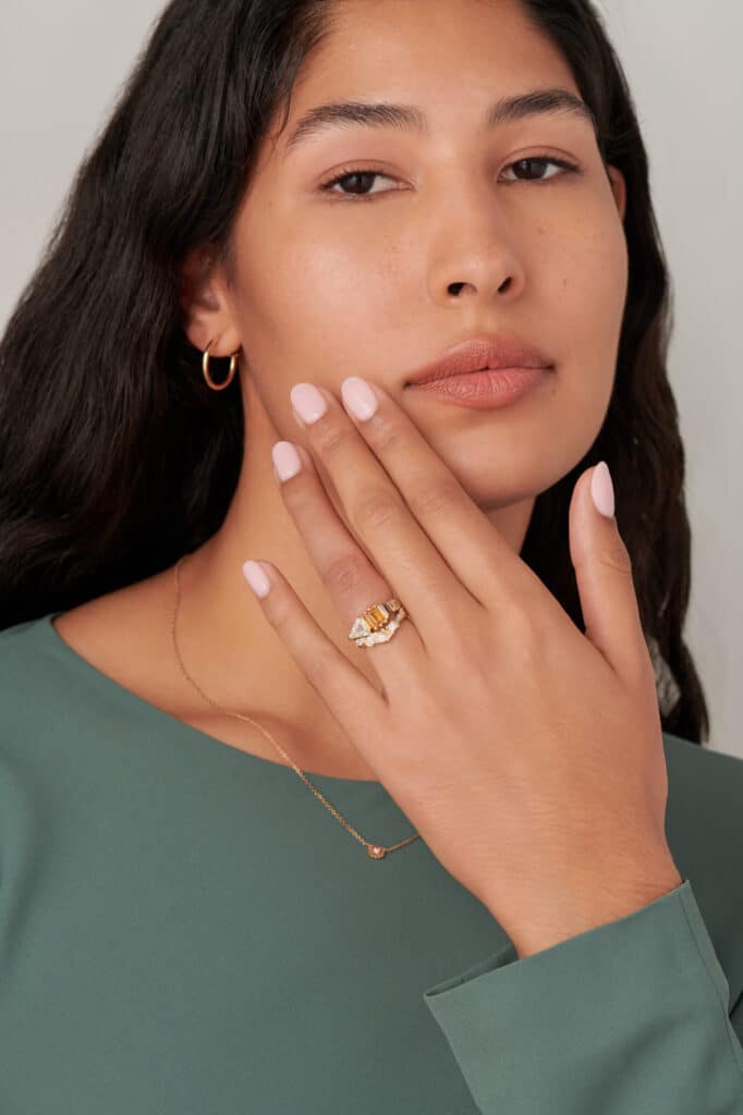 Fusion Shield Cut Diamond and Apricot Sapphire Ring and Fusion Diamond Band on Figure
