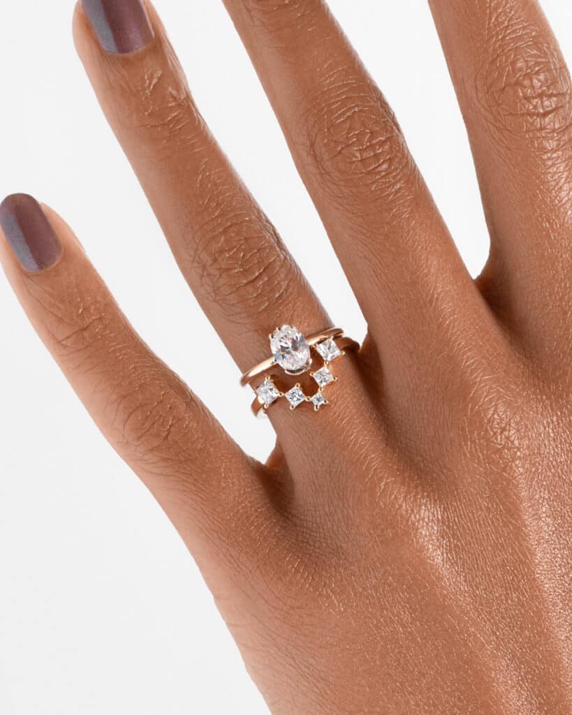 Cascading Princess Cut Diamond Band_with_Lash Diamond Oval Ring_ECOMM_On Figure_WEB2