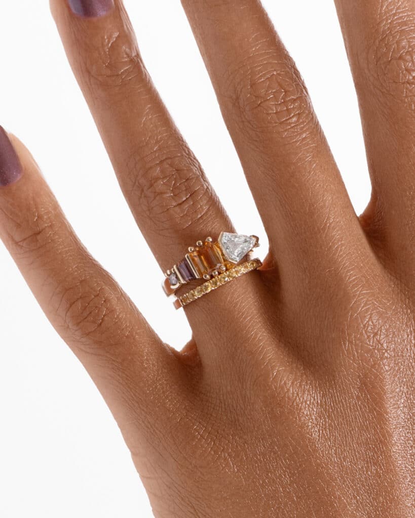 Fusion Shield Cut Diamond and Apricot Sapphire Ring_with_Eternity Half Yellow Sapphire Wide Band_ECOMM_On Figure_WEB2