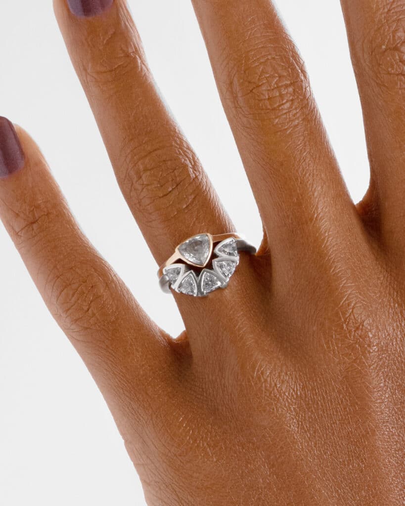 Trillion White Sapphire Ring with Trillion Curved Diamond Band on figure