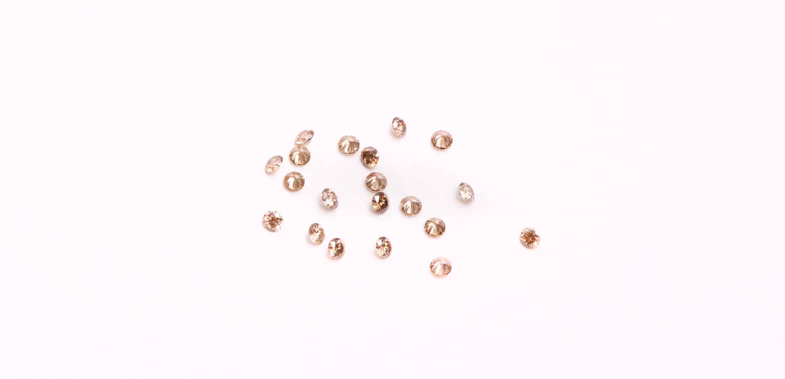 multiple loose round brown gemstones